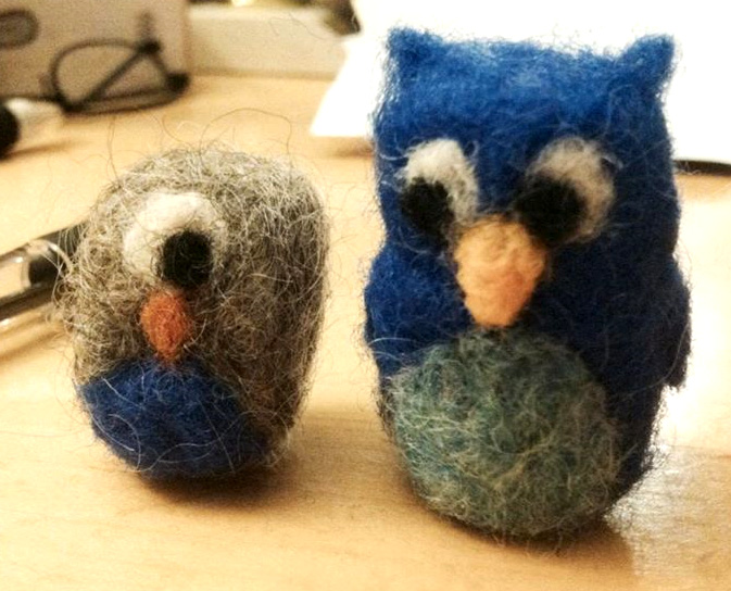 Needle felted owls by M. Barnes and K. Talmage. Wool, less than 2" tall.