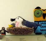 The center bird is a White-breasted Nuthatch crocheted by E. Spinney