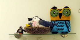 The center bird is a White-breasted Nuthatch crocheted by E. Spinney