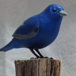 Indigo Bunting carved by Ingrid Riga for a Fall Festival Raffle (fence-post style base provided by Dick Allen)