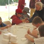 Ingrid teaches soap carving to children at Dead Creek Wildlife Day