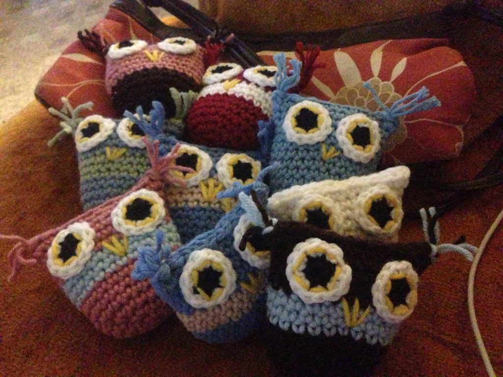 9 crocheted owls in a small pile