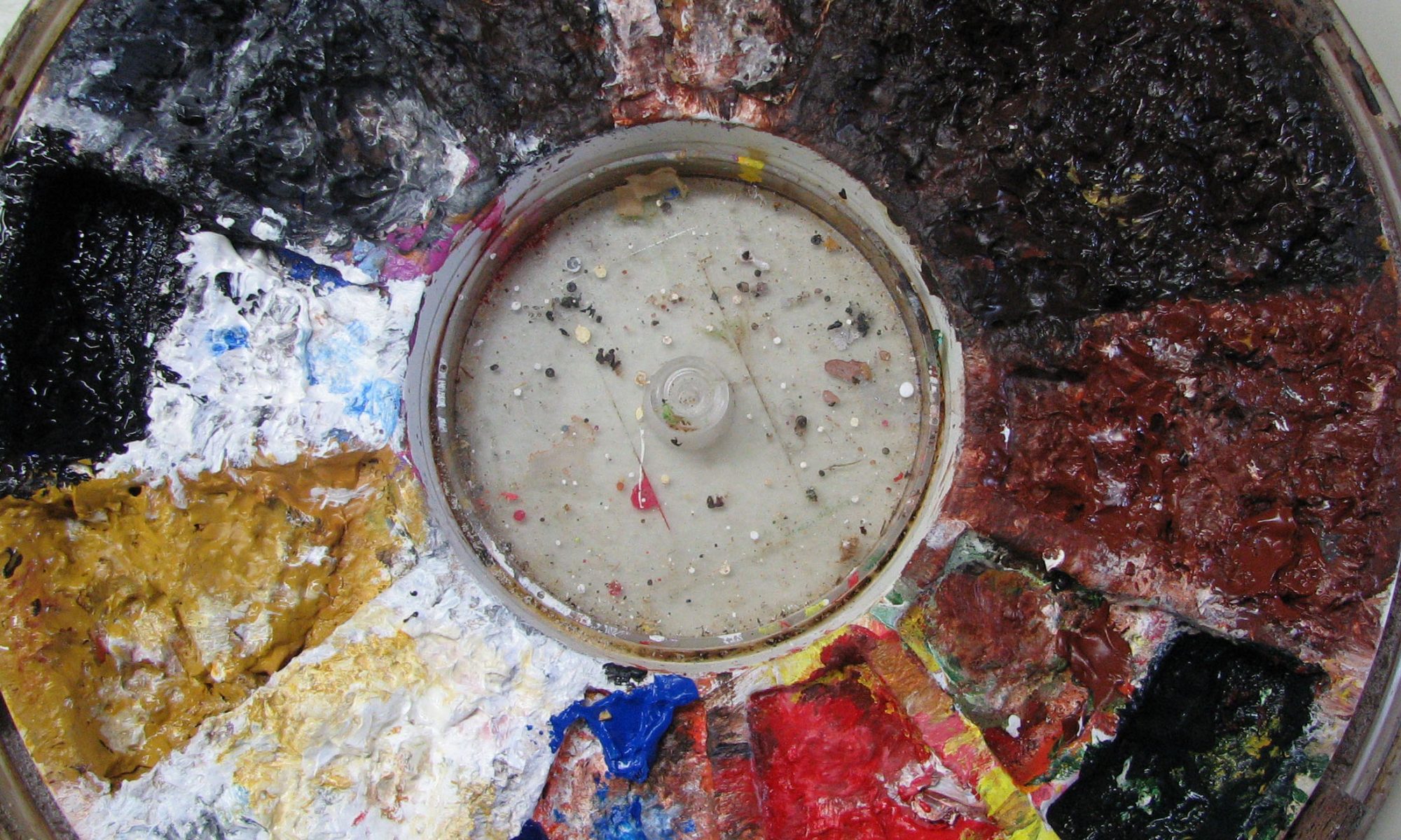 round paint palette filled with paint