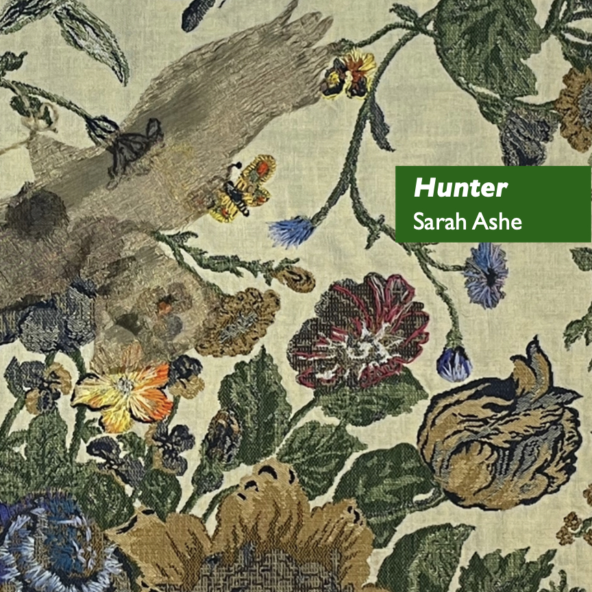 A hawk is silhouetted against a pale sky, seen from beneath flowers. Title: Hunter. Fabric, embroidery by Sarah Ashe. Copyright © 2024 and used with permission. #PowerOfPerspective
