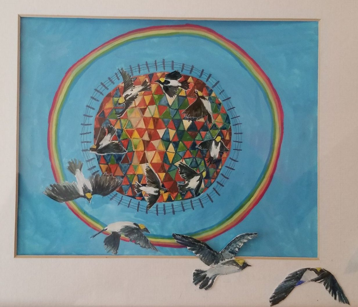 A geodesic multi-colored sphere is ringed by a rail and wire fence, and then by a rainbow, on a saky-blue background. Many Bobolinks (a black and white bird with yellow nape) emerge in a spiral from the geodesic world and fly out and in front of the fence and the rainbow. "A Spell for a World Without Borders" copyright © Meili Stokes and shown with permission.